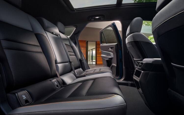 2026 Honda Prologue Elite interior, with gray leather seats viewed from the side.
